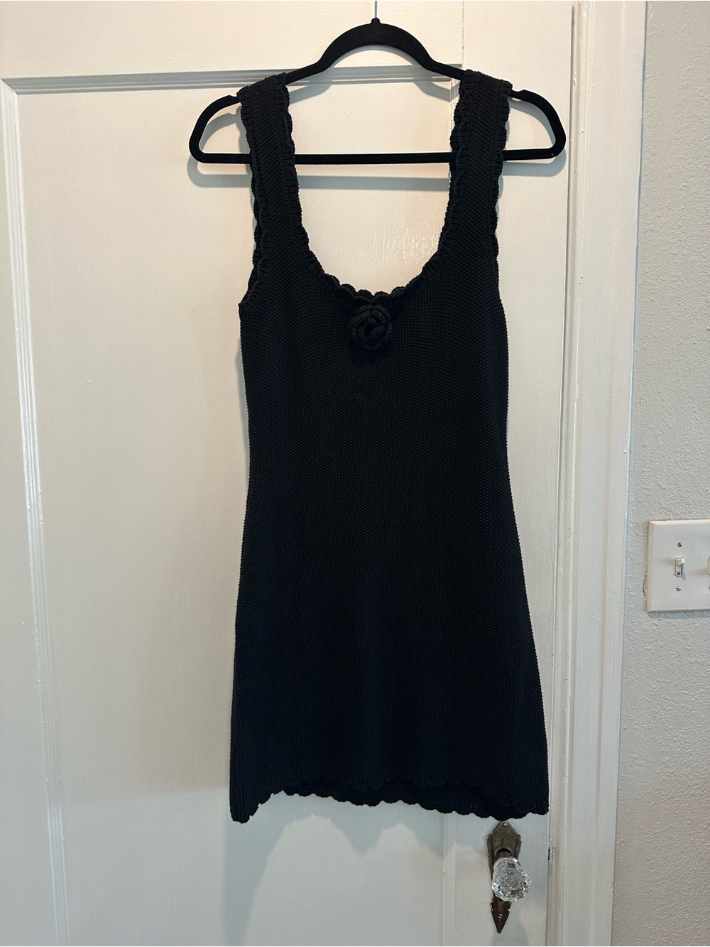 Black Knit Sleeveless Dress with Floral Accent